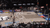 a basketball game is being played on a court that says bkn on it