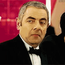 Rowan Atkinson Wink GIF - Rowan Atkinson Wink Awkward GIFs