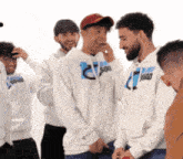 a group of men wearing hoodies that say sou