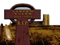a cross with the name larcen tyler on it in gold