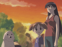 a woman and two children standing next to each other with a dog in the background