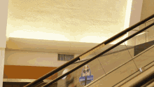 an escalator with a sign that says red bull