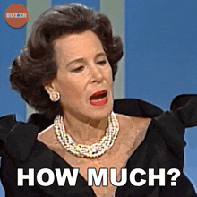 a woman in a black dress and pearls is asking how much