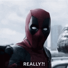 deadpool is taking a picture of himself with the words `` really ? ''