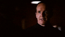 a close up of a man with the words oh spoiler alert behind him