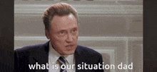 a man in a suit and tie is asking what is our situation dad
