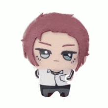 a stuffed toy of a boy with purple hair and blue eyes .