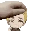 a hand is touching a man 's head with a towel .