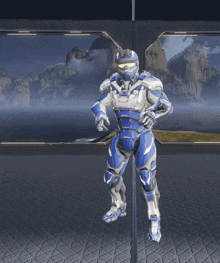a white and blue robot is laying on its back