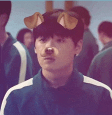a young man wearing a dog mask is standing in a crowd .