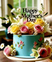 a mother 's day cake with flowers on top and a sign that says happy mother 's day