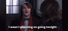 a man wearing a bow tie and scarf says i wasn 't planning on going tonight ..