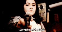 a young girl is holding a remote control and asking do you want to play