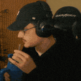a man wearing headphones and a hat that says 47 on it