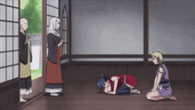 a group of people are kneeling down in a room with a monk standing behind them