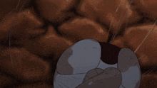 a cartoon cat with an angry face and a cross on its chest