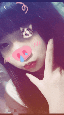 a girl with a cat on her face has a heart on her nose
