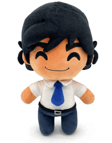 a stuffed toy with black hair and a white shirt and tie