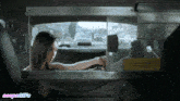 a gif of a woman in a car with the words vespagifs on the bottom