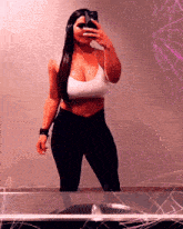 a woman is taking a selfie in a bathroom mirror