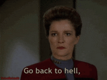 a woman says " go back to hell " while looking at the camera