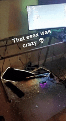 a computer monitor sits on a desk with a skull and the words that essex was crazy