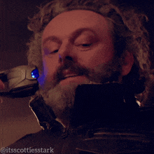 a close up of a man 's face with the words " itsscottiesstark " on the bottom
