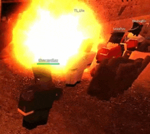 a group of people are standing in front of a large fireball .