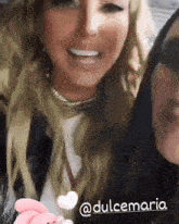two women are posing for a picture and one of them has the name dulcemaria written on the bottom