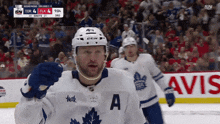 a hockey player wearing a jersey that says a on it