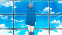 a girl in a blue school uniform stands in front of a window looking at the sky