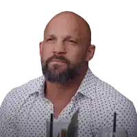 a bald man with a beard is wearing a white shirt with black stars on it