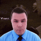 a man in a blue shirt and tie is looking at the camera with a viggle.ai logo in the background