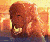 a close up of a girl 's face with a ponytail .