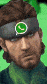 a close up of a man 's face with a whatsapp logo on his headband
