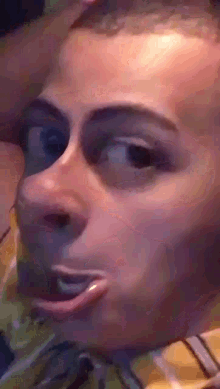 a close up of a person 's face with a slight smile on it
