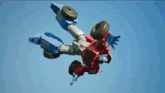 a robot is flying through the air with a wheel on its head