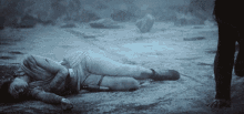 a person laying on the ground with a watch on their wrist that says ' i love you ' on it