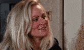 a close up of a woman 's face with blonde hair