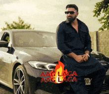 a man is sitting on the hood of a car with the words aag laga aag laga on it