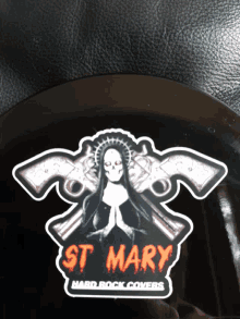 a sticker with a nun and two guns says sit mary hard rock covers