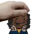 a hand is touching a cartoon character 's face .