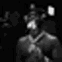 a black and white photo of a person in a dark room