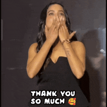 a woman in a black dress is blowing a kiss and the words thank you so much are above her