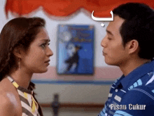 a man and a woman are looking at each other and the words pisau ukur are on the bottom right