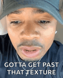 a close up of a man 's face with the words gotta get past that texture