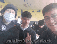 a group of young men posing for a picture with the caption maldito niñas mariack