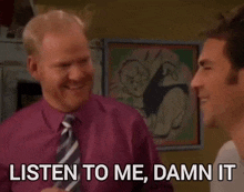 a man in a purple shirt and tie is talking to another man who says listen to me damn it