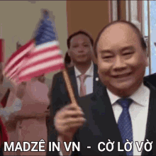 nguyen xuan phuc wave flag smile