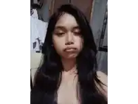 a woman without a shirt is making a funny face